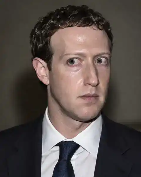 Generated editorial portrait of Mark Zuckerberg with a wide, blank flash-lit stare.