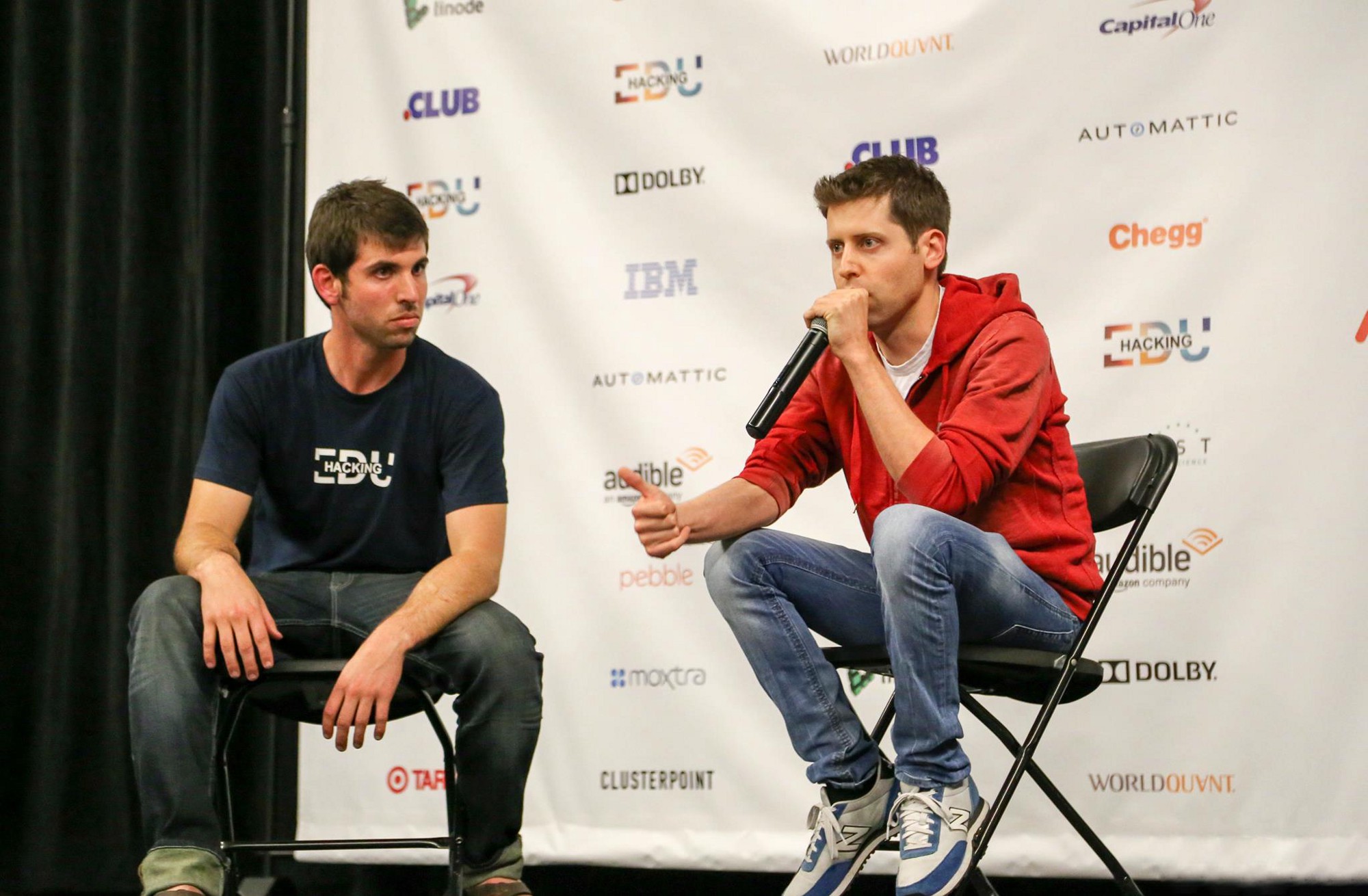 Sam Altman speaking onstage at HackingEDU in 2016